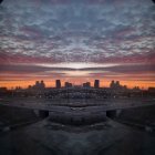 Surreal sunset landscape with sheep, giant bird, and reflective orbs