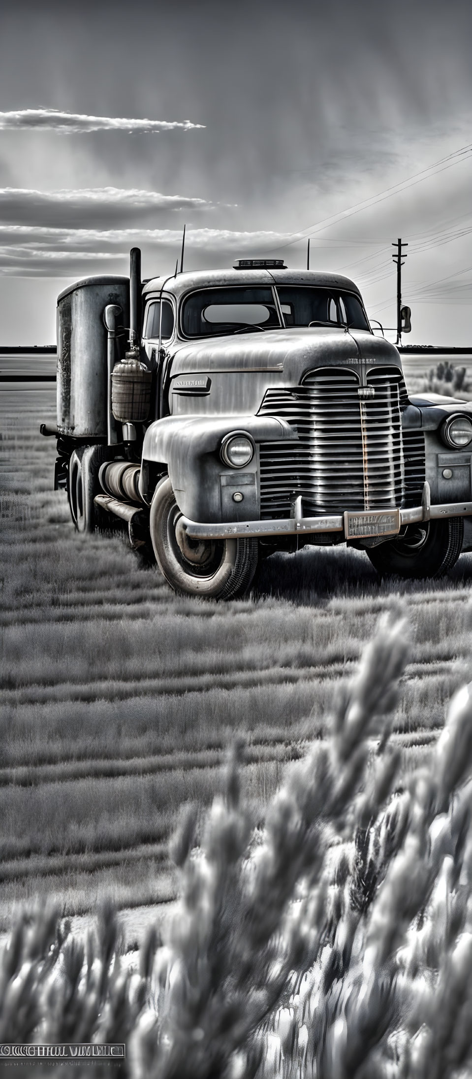 Classic Vintage Semi-Truck in Field with Overcast Skies