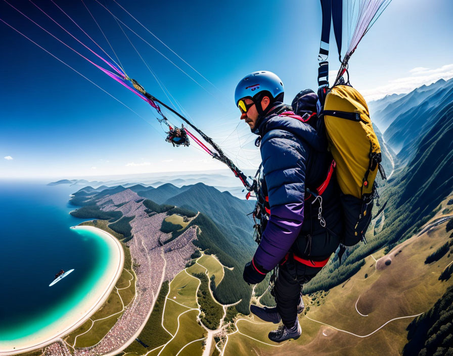 Yellow backpack paraglider soaring over coastal region with sea, ship, and mountains.