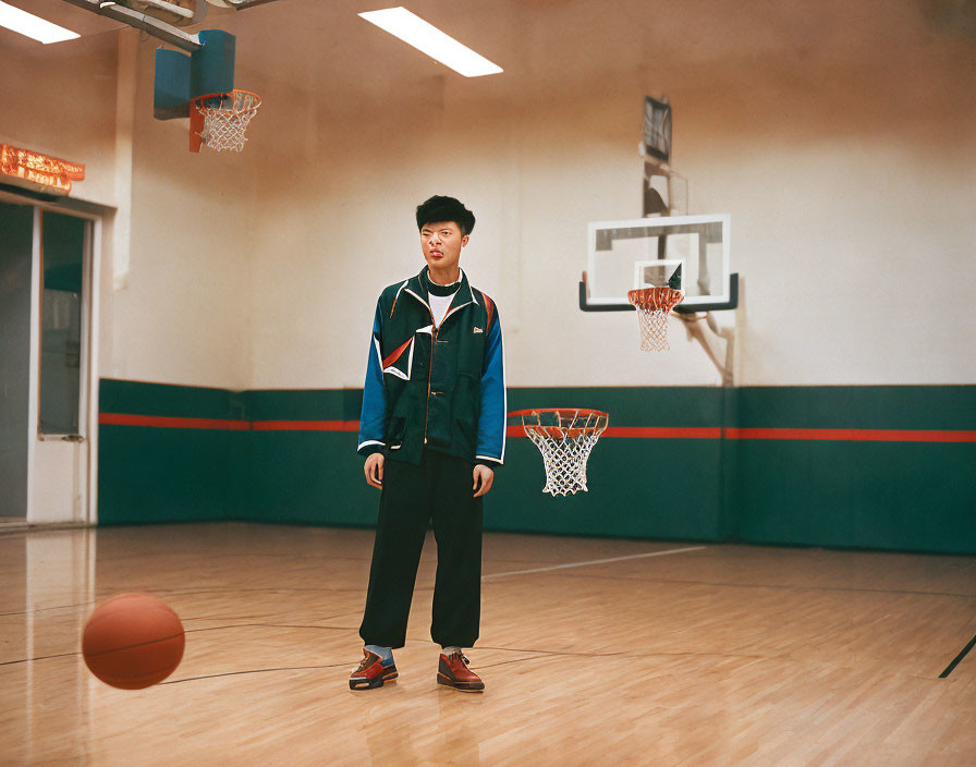 Person in stylish outfit on basketball court with basketball