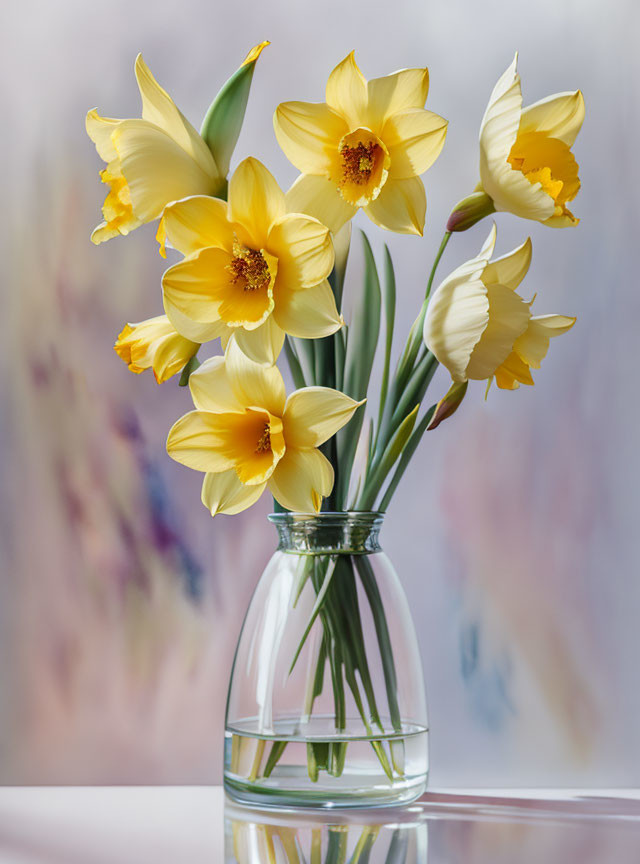 Fresh Yellow Daffodils in Clear Glass Vase on Soft Background