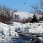 Snowy Cabin by Stream in Winter Wonderland