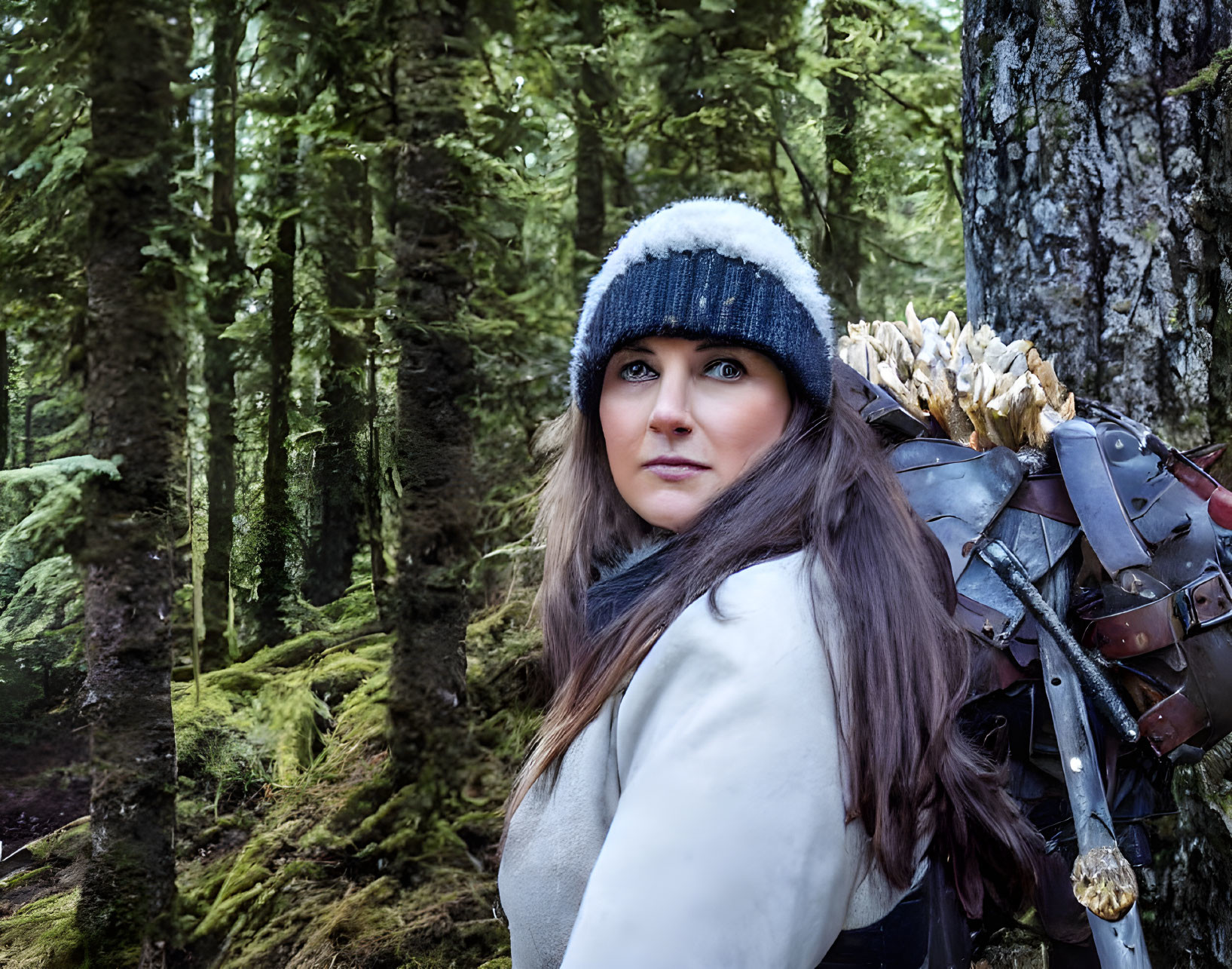 Woman in Knitted Hat with Arrows in Green Woods