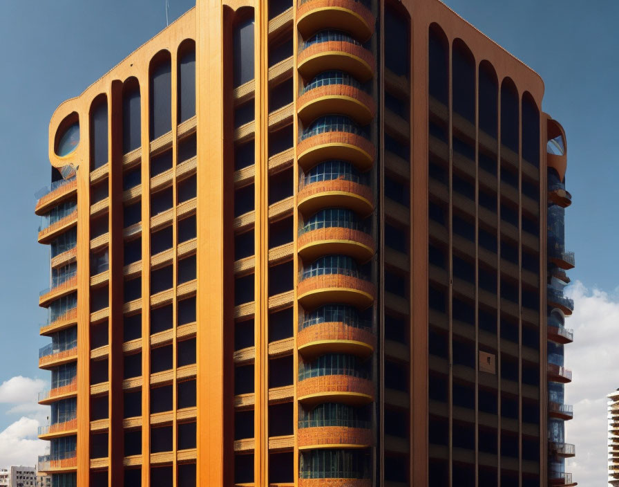 Contemporary building with orange facade and circular balconies under blue sky