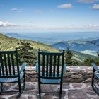 Scenic mountain range view from wood deck