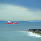 Digitally altered image of surreal scene with massive waves and ships in tumultuous sea