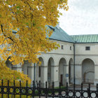 Classic White House Surrounded by Autumn Trees on Foggy Morning