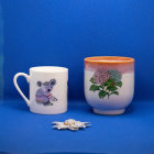 Floral Design Porcelain Cups on Blue Surface