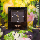 Vintage Clock with Blooming Flowers and Roman Numerals in Warm Light