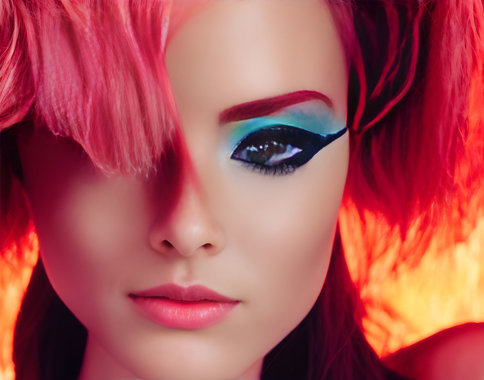 Vibrant pink hair and bold blue eyeshadow with fiery background