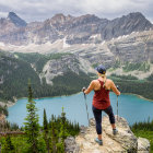 Fantasy character in large hat admires majestic landscape