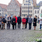 Group in Blue Uniforms with Anthropomorphized Anteaters in Cobblestone Setting