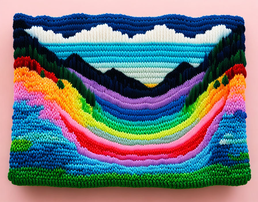 Vibrant mountain-themed beadwork with rainbow on pink backdrop