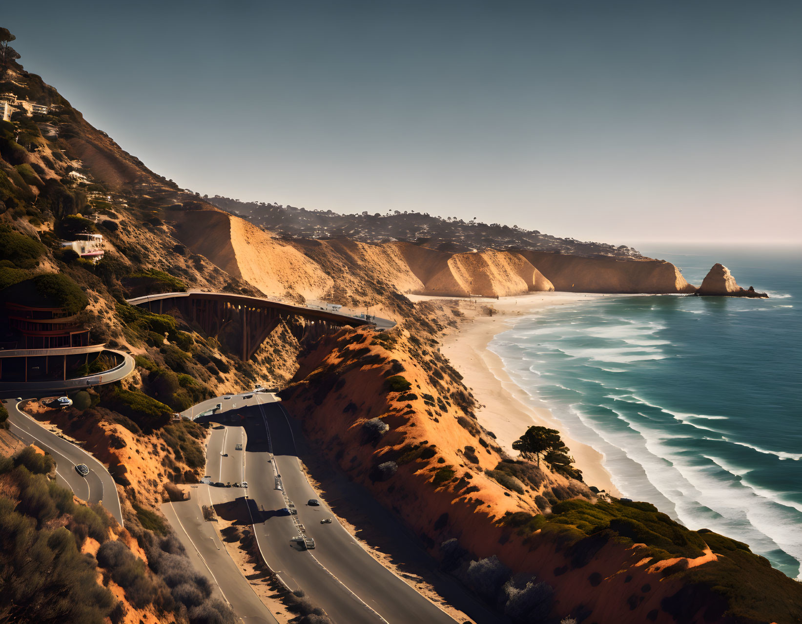 Scenic Coastal Road Overlooking Beach and Ocean