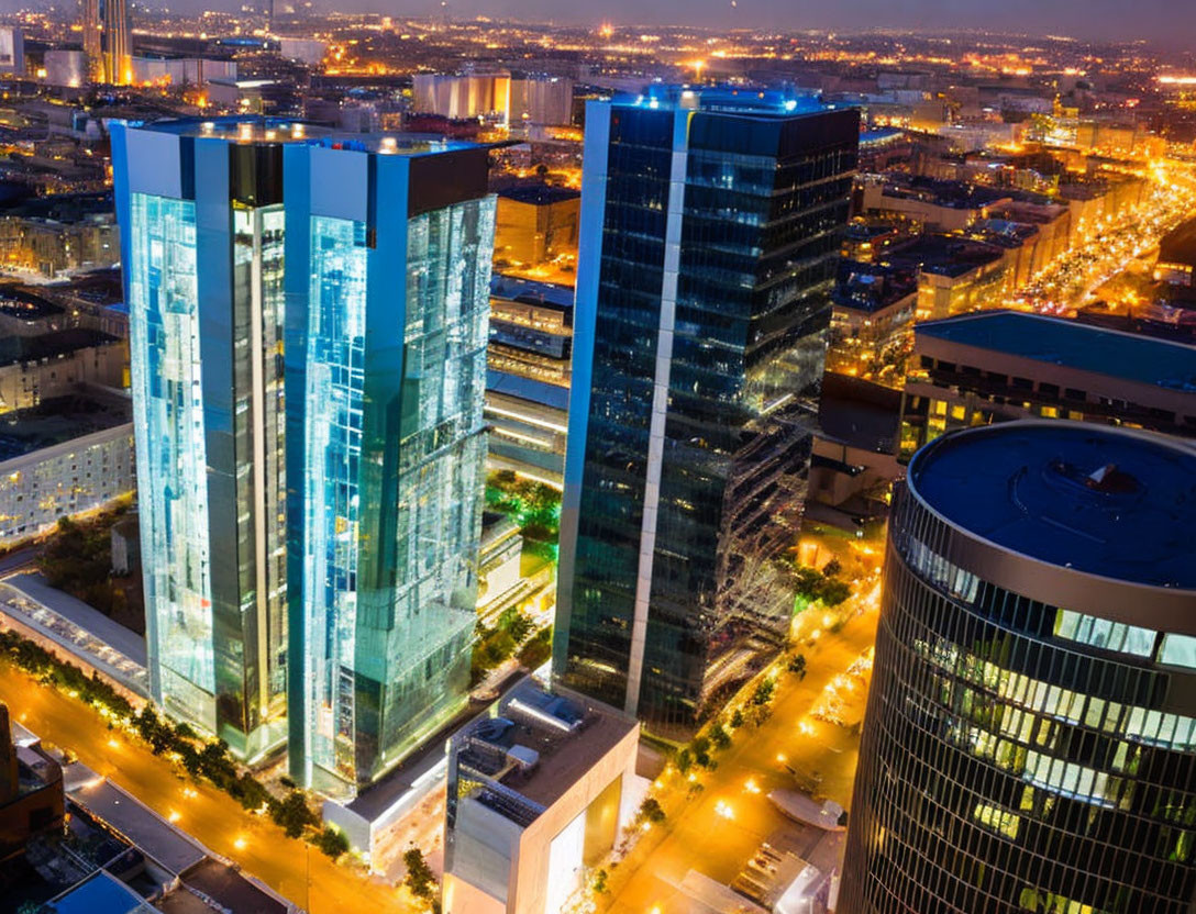 Modern Cityscape: Aerial Night View with Illuminated Skyscrapers & Urban Architecture