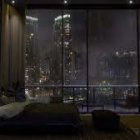 Modern Lounge with Stylish Furniture and Cityscape View at Night