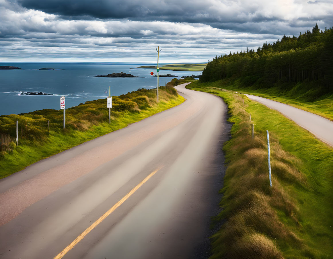 Scenic winding road with traffic signs in lush green landscape