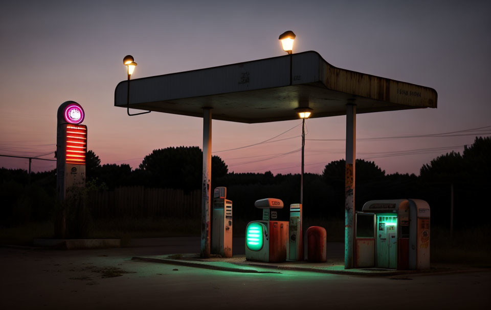 Deserted gas station with vintage fuel pumps at twilight