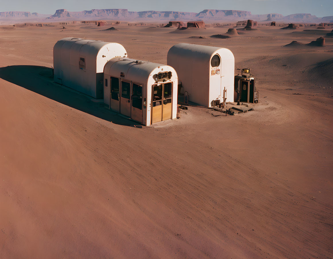 Futuristic white habitation modules in vast desert landscape