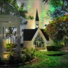 Tropical Chapel Surrounded by Lush Foliage and Palm Trees