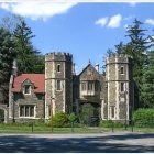 Whimsical fairy tale castle in lush greenery & vibrant gardens