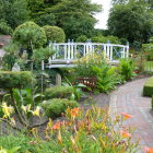 Scenic garden with white arched bridge and vibrant flowers