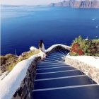 Twilight white stairway overlooking serene sea with sailboats