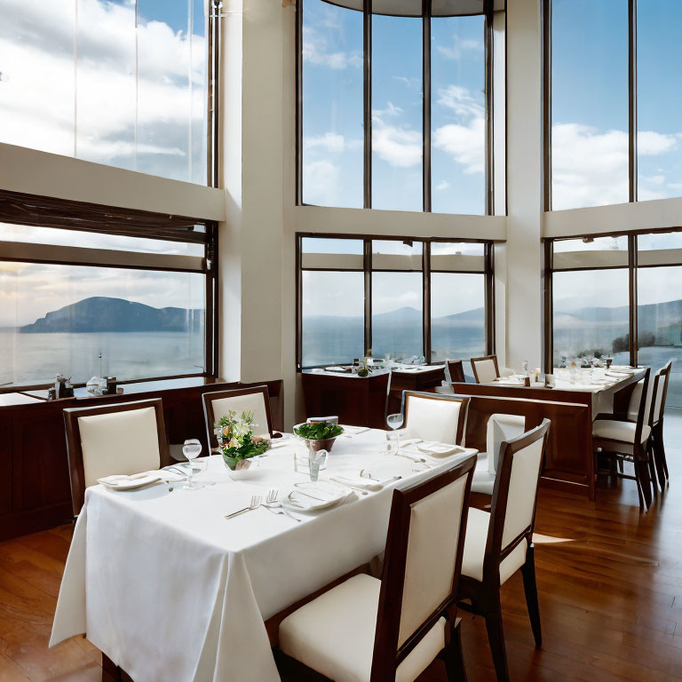 Sophisticated Restaurant Interior with Sea View and Set Tables