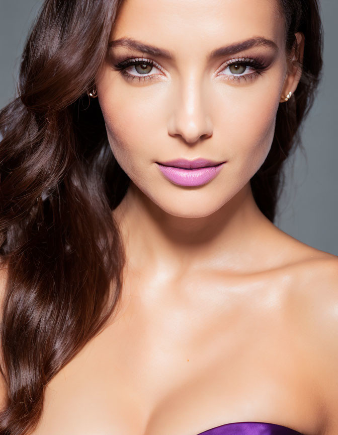 Woman with Smoky Eye Makeup, Purple Lipstick, and Wavy Brunette Hair
