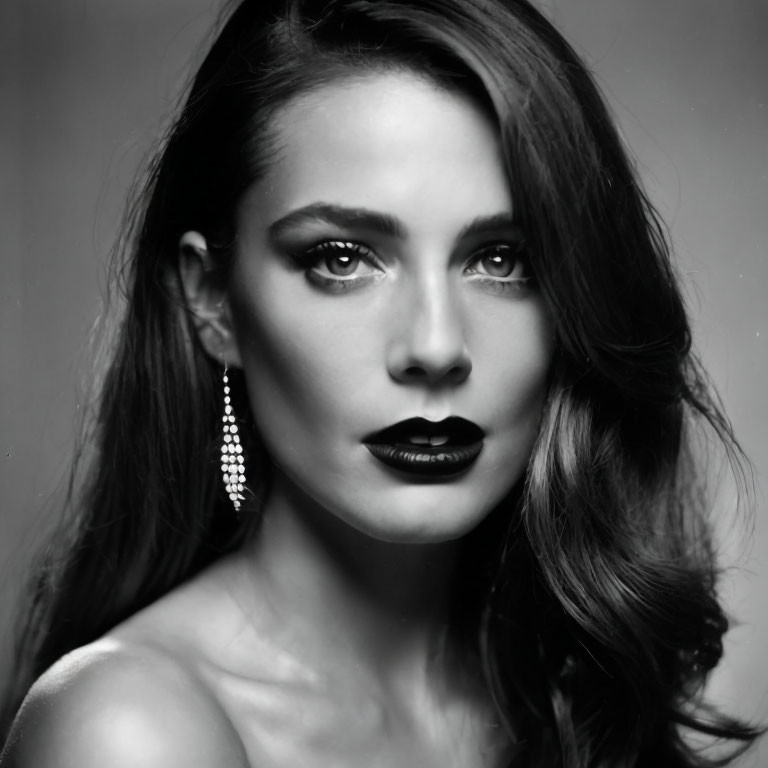 Monochrome portrait of woman with dark lipstick and smoky eyes