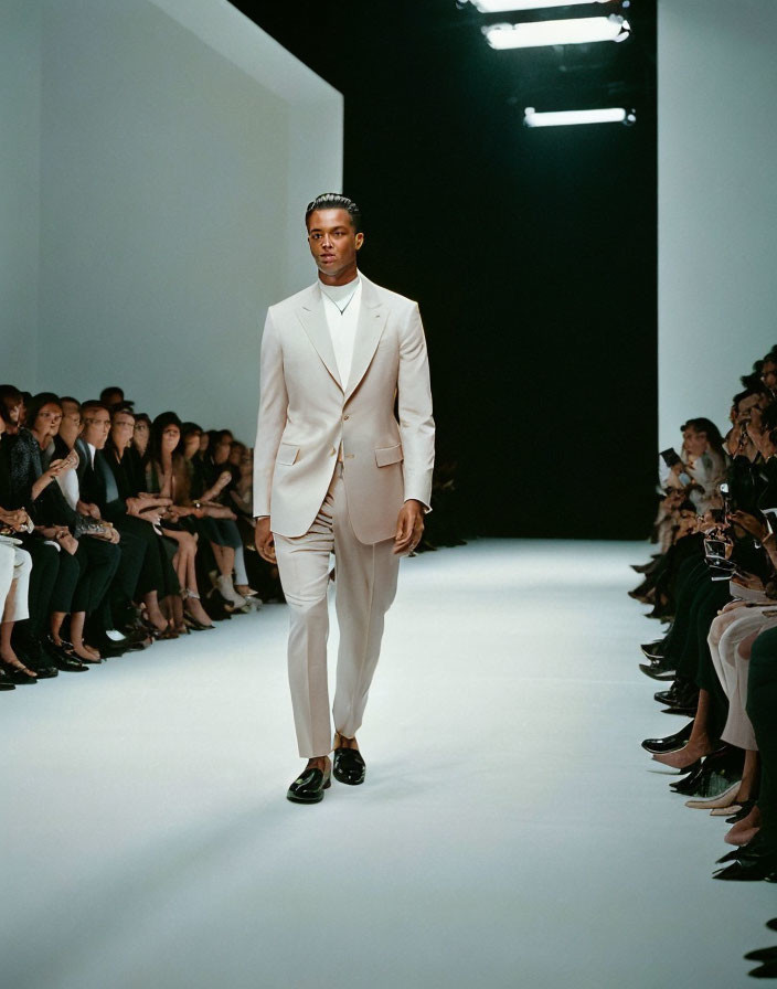 Male Model in Cream Suit on Fashion Show Runway