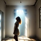 Silhouetted figure in abandoned room with light beam and debris