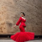 Woman in Red Flamenco Dress Dancing Amid Flying Rose Petals