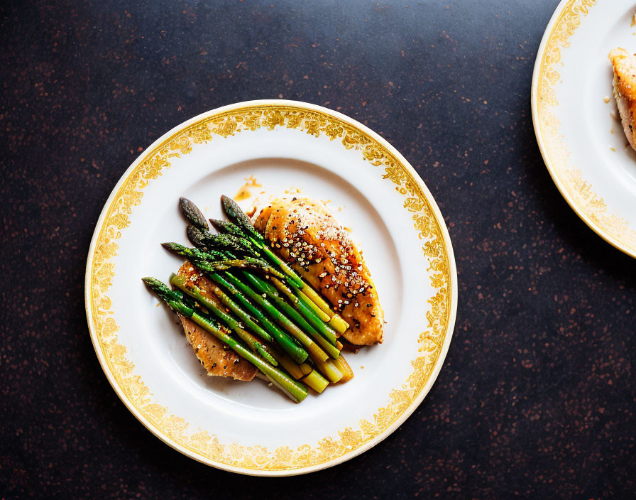 Grilled Chicken Breasts with Sesame Seeds and Asparagus on White Plate