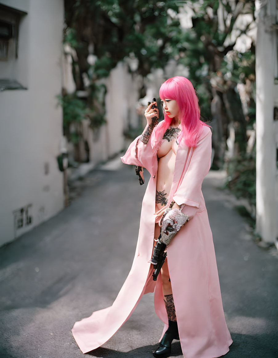 Pink-haired person in long coat with rifle on path