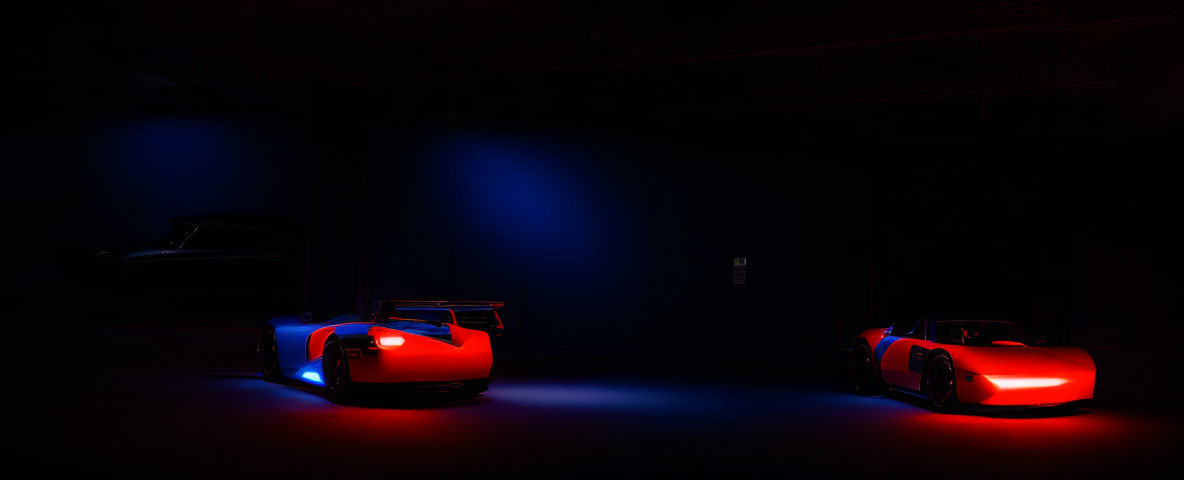 Luxurious sports cars with underbody lights in dimly lit room