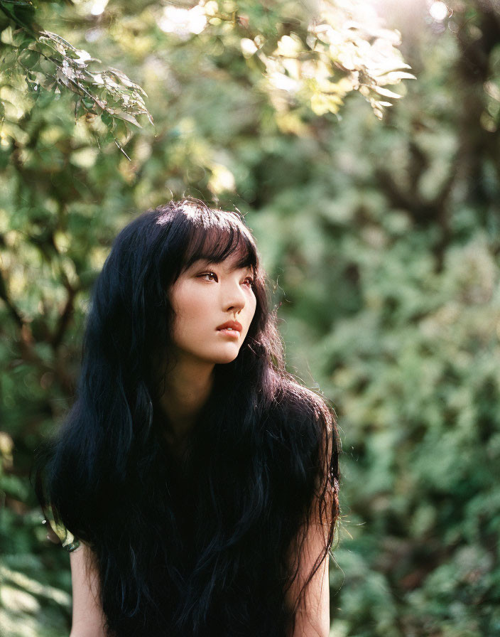 Long-Haired Woman Contemplating in Green Nature