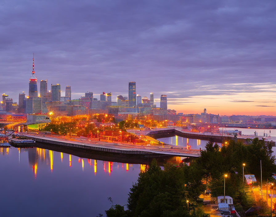 Vibrant cityscape with illuminated buildings and colorful sky