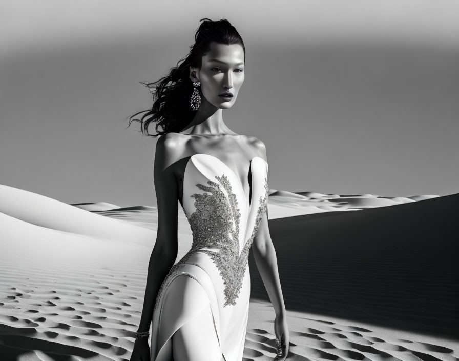 Monochrome desert photoshoot with model in elegant white dress