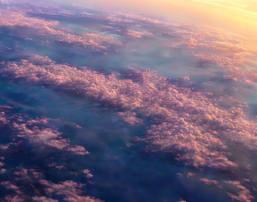 Tranquil sunset sky with fluffy pink and golden clouds