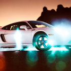 White Sports Car with Illuminated Wheels Emitting Smoke Against Orange Sky and Mountain Silhouette