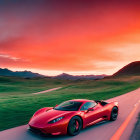 Red sports car driving on winding road through rolling hills at sunset