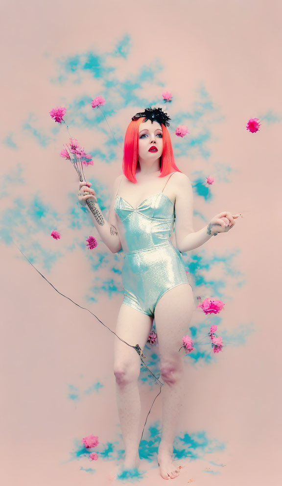 Red-haired person in blue bodysuit with bouquet on pink background