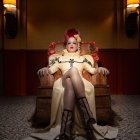 Regal animated queen on throne in luxurious room