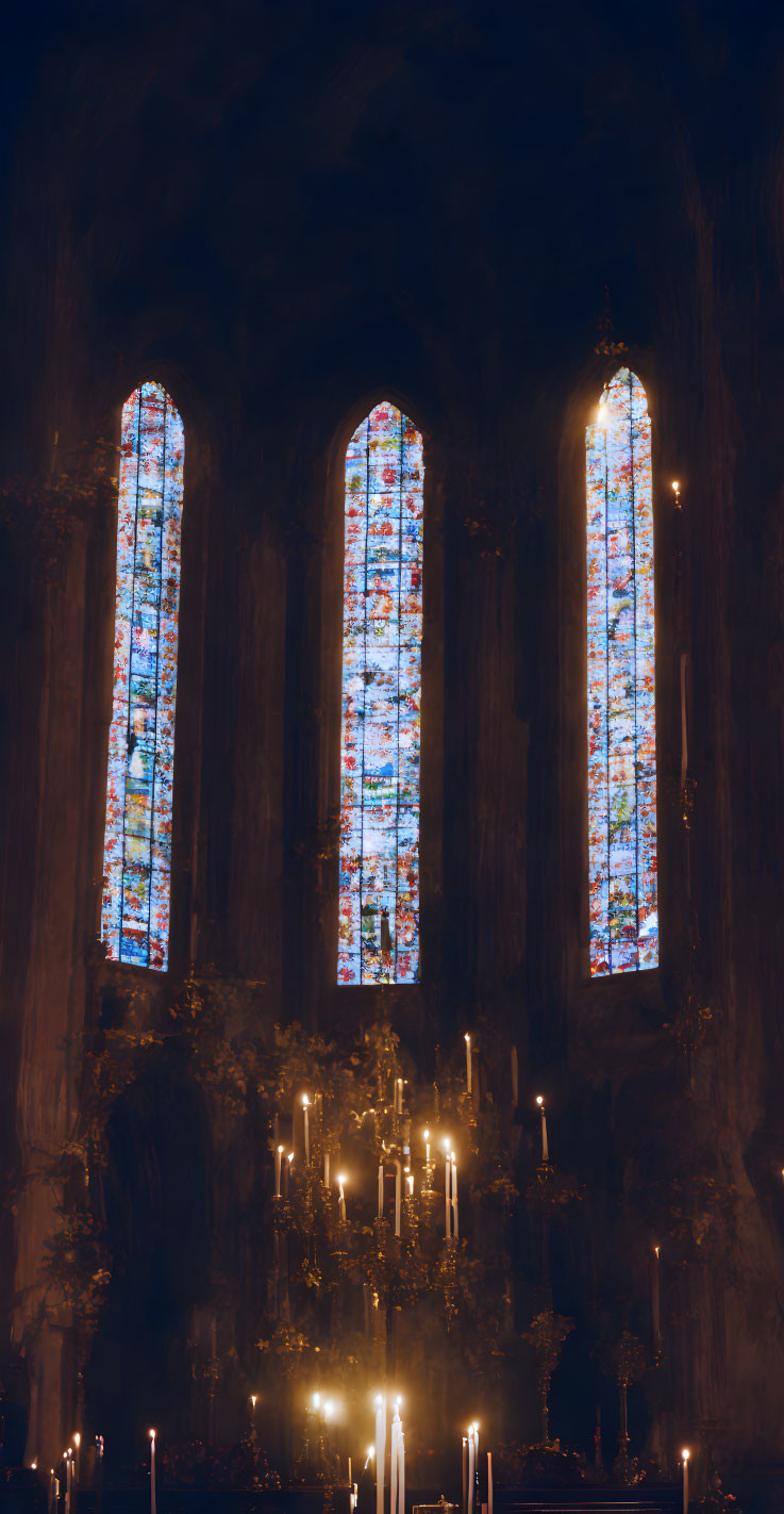 Stained Glass Windows in Dimly Lit Church with Burning Candles