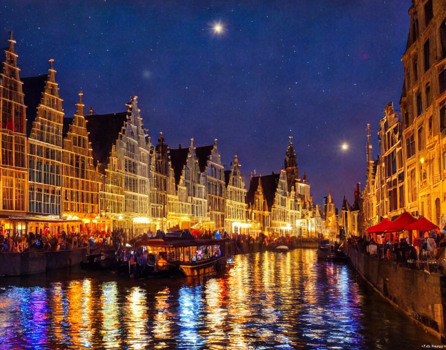 Historical buildings and boats on illuminated canal at night