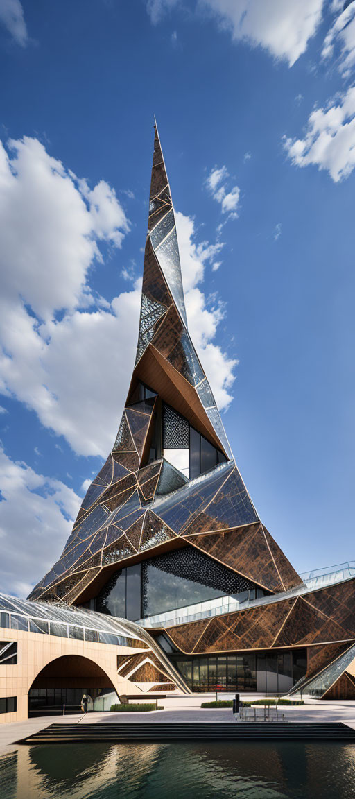 Modern building with sharp spire & geometric patterns against blue sky