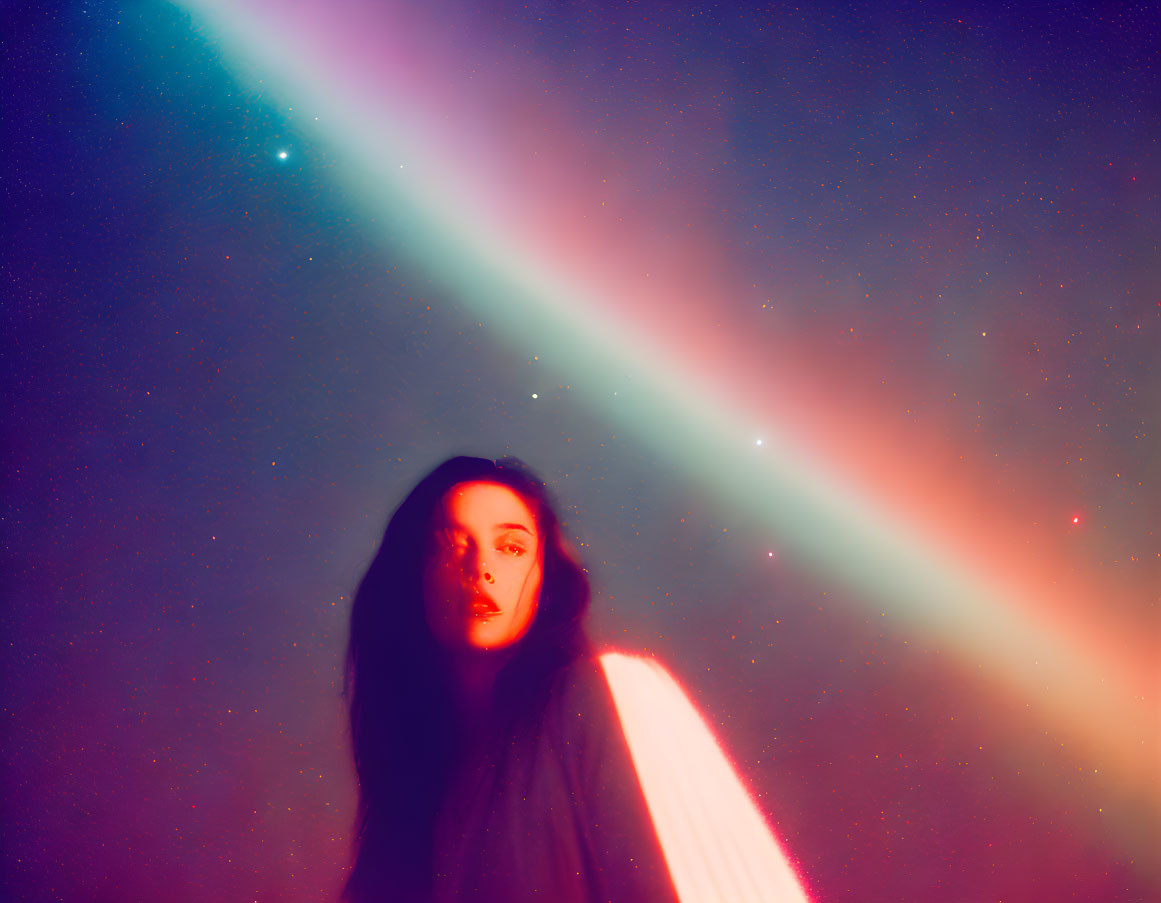 Mysterious woman in colorful haze with bright light beam