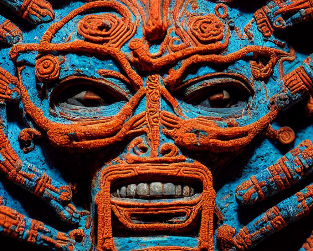 Detailed Mesoamerican Stone Carving with Vibrant Blue and Orange Colors