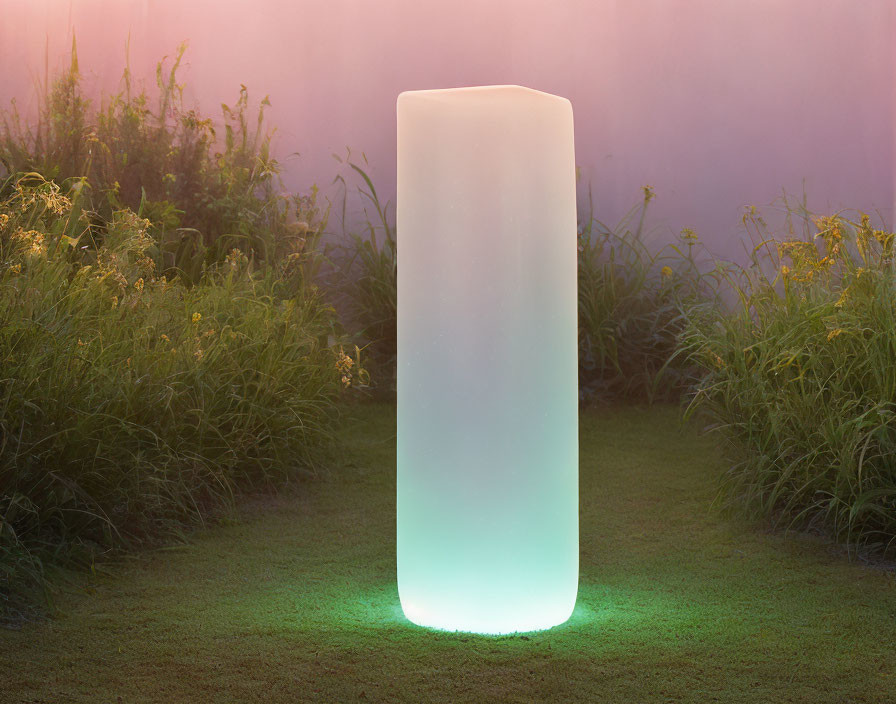 Green and White Glowing Cylinder in Grass Field